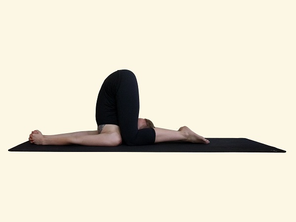 Karnapidasana-Ear-Pressure-Posture